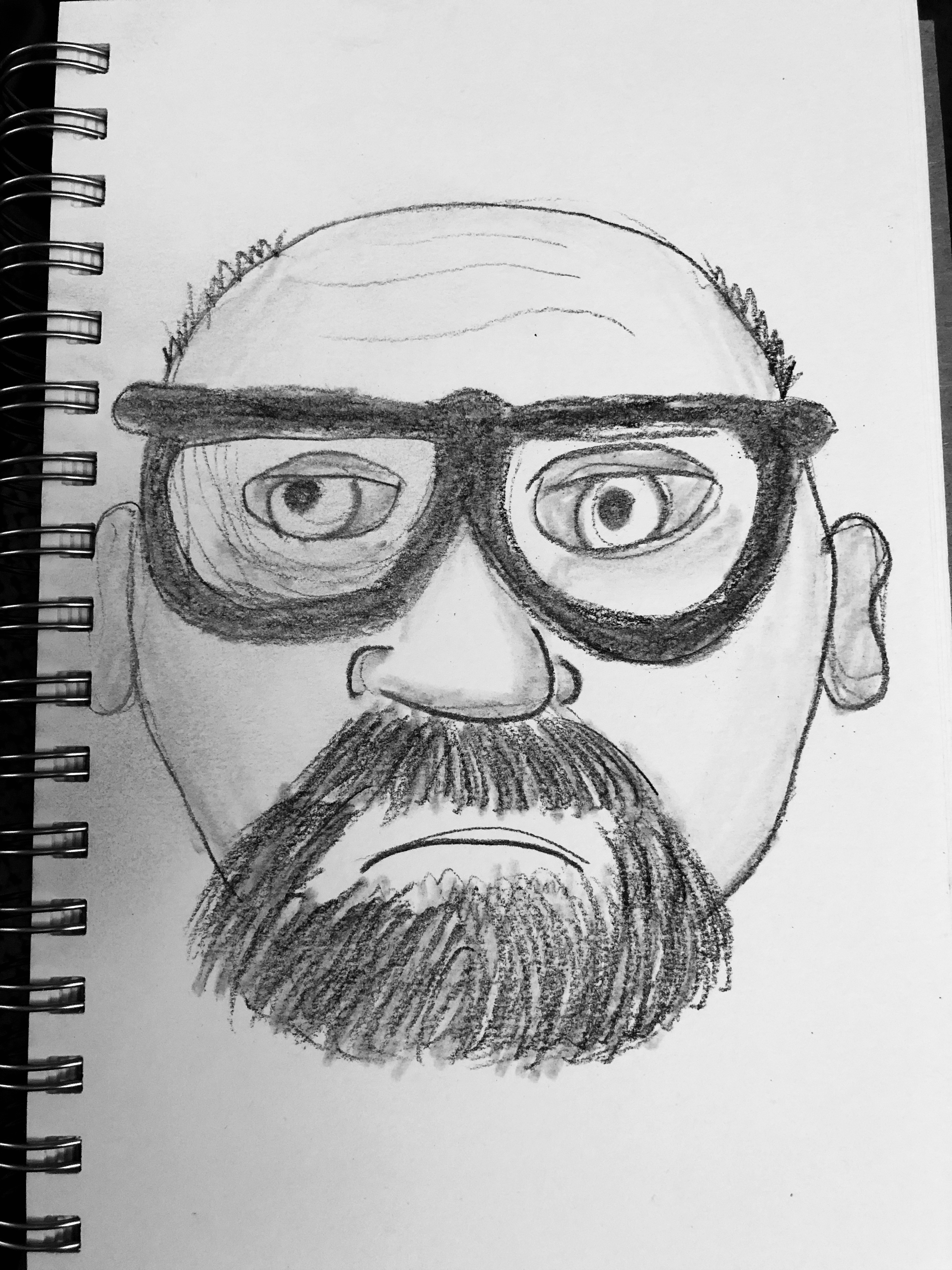Charcoal drawing of a balding guy with glasses and a goatee